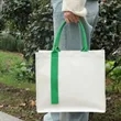 Custom Canvas Gift Bag With Handle And Laminated Surface | https://www.bestnamebadges.com