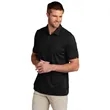 TravisMathew Coto Performance Polo. | https://www.bestnamebadges.com