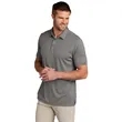 TravisMathew Coto Performance Polo. | https://www.bestnamebadges.com