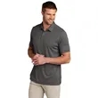 TravisMathew Coto Performance Polo. | https://www.bestnamebadges.com