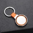 Round Metal Keychain with Leather Strap | https://www.bestnamebadges.com